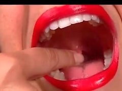 Hot girl swallows huge gummy rat and shows her.