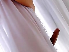 Cute Asian shemale Fany wanks her massive dick on a bed